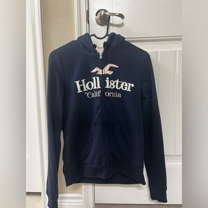 Navy Blue Faux fur Hollister zip up hoodie. Lightly worn. Size small.